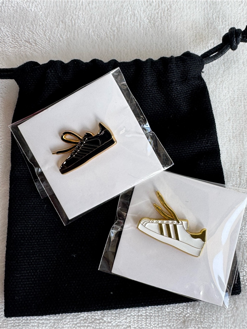2 Brand New Snickers Pins Brooch. White and Black